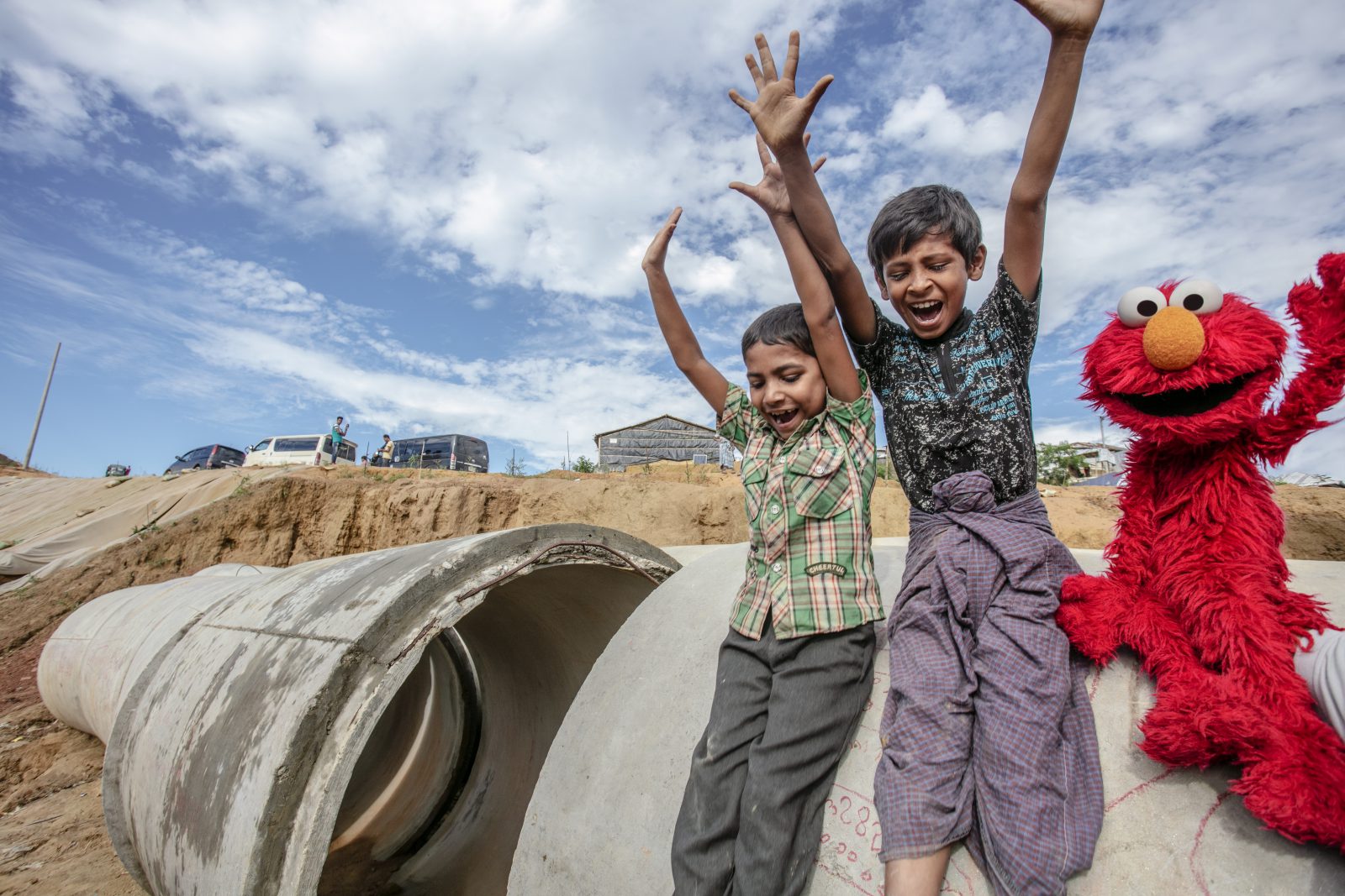 Two Rohingya refugee children have once in a life time moment with Elmo! More than 900,000 Rohingya refugees are now living in Bangladesh – nearly 60 percent of those refugees are children.